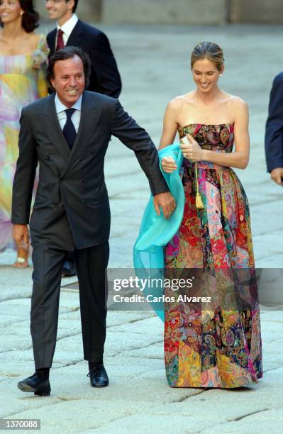 Spanish singer Julio Iglesias and his wife Miranda arrive at the Chapel of the Monastery of El Escorial for the wedding of Ana Aznar, daughter of...