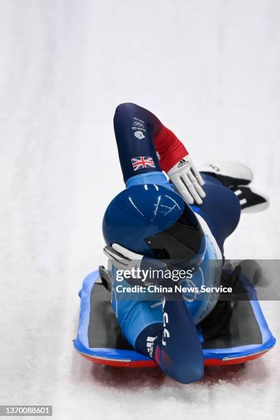 Matt Weston of Team Great Britain reacts after sliding during the Men's Skeleton Heat 4 on day seven of Beijing 2022 Winter Olympic Games at National...