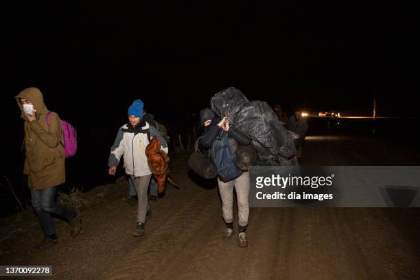 Refugees who want to cross into Europe illegally through Turkey try to cross the Greek border on February 11, 2022 in Edirne, Turkey. Security...