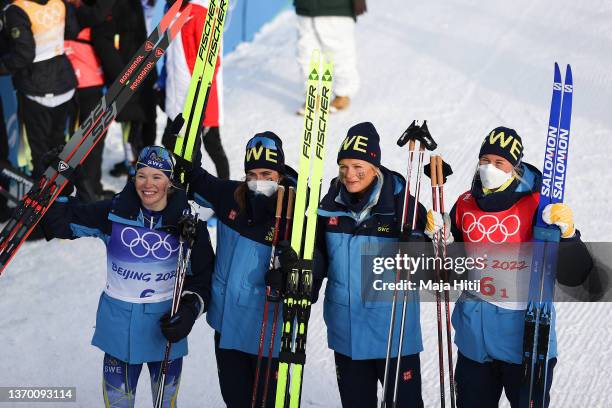 Bronze medallists Maja Dahlqvist, Ebba Andersson, Frida Karlsson and Jonna Sundling of Team Sweden celebrate during the Women's Cross-Country 4x5km...