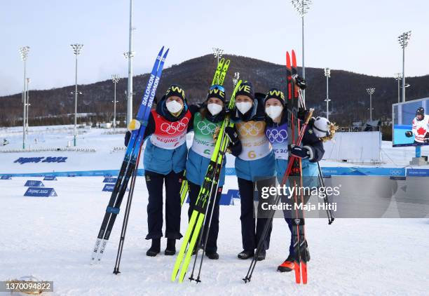 Bronze medallists Maja Dahlqvist, Ebba Andersson, Frida Karlsson and Jonna Sundling of Team Sweden celebrate during the Women's Cross-Country 4x5km...