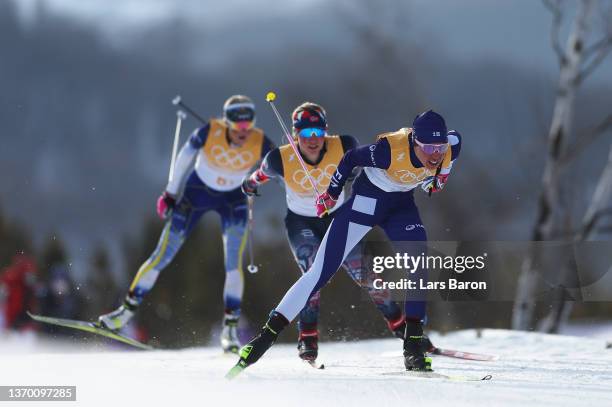Kerttu Niskanen of Team Finland, Helene Marie Fossesholm of Team Norway and Frida Karlsson of Team Sweden compete during the Women's Cross-Country...