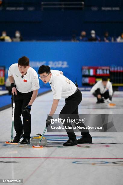 Zhiyu Wang and Jingtao Xu of Team China compete against Team Italy during the Men's Round Robin Curling Session on Day 8 of the Beijing 2022 Winter...