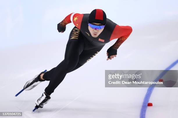 Tingyu Gao of Team China skates on the way to setting a new Olympic record time of 34.32 during the Men's 500m on day eight of the Beijing 2022...