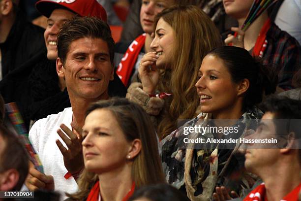 Mario Gomez and girlfriend Silvia Meichel attend the Beko Basketball match between FC Bayern Muenchen and EWE Baskets Oldenburg at Audi-Dome on...