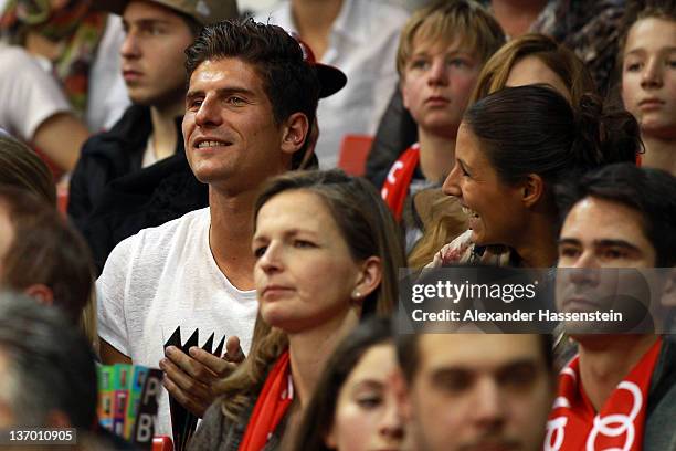 Mario Gomez and girlfriend Silvia Meichel attend the Beko Basketball match between FC Bayern Muenchen and EWE Baskets Oldenburg at Audi-Dome on...