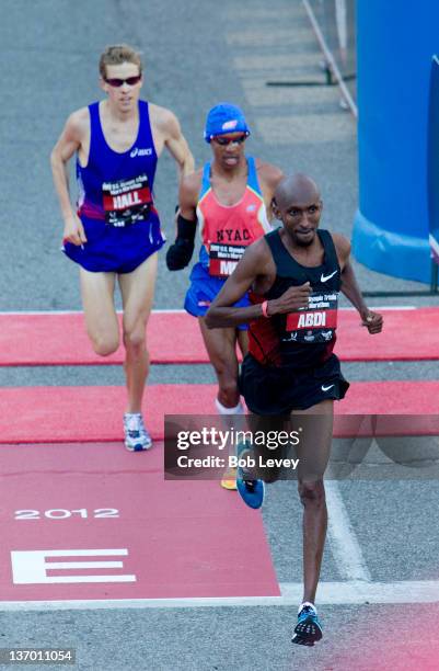 Abdi Abdirahman leads Meb Keflezighi and Ryan Hall during the U.S. Marathon Olympic Trials on January 14, 2012 in Houston, Texas.