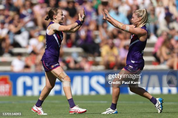 Kara Antonio and Hayley Miller of the Dockers celebrate a goal during the round six AFLW match between the Fremantle Dockers and the Carlton Blues at...