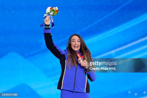 Bronze medallist Dorothea Wierer of Team Italy poses with their medal during Women's Biathlon 7.5km Sprint medal ceremony on Day 8 of the Beijing...