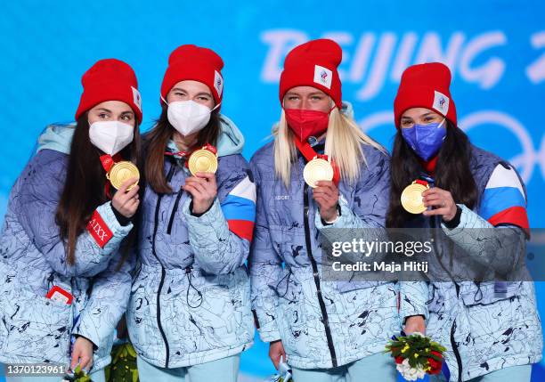 Gold medallists Yulia Stupak, Natalia Nepryaeva, Tatiana Sorina and Veronika Stepanova of Team ROC pose with their medals during the Women's...