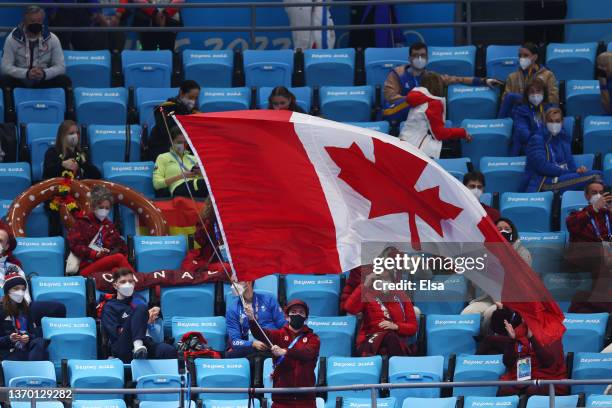 Team Canada team members show their support from the stands during the Ice Dance Rhythm Dance on day eight of the Beijing 2022 Winter Olympic Games...