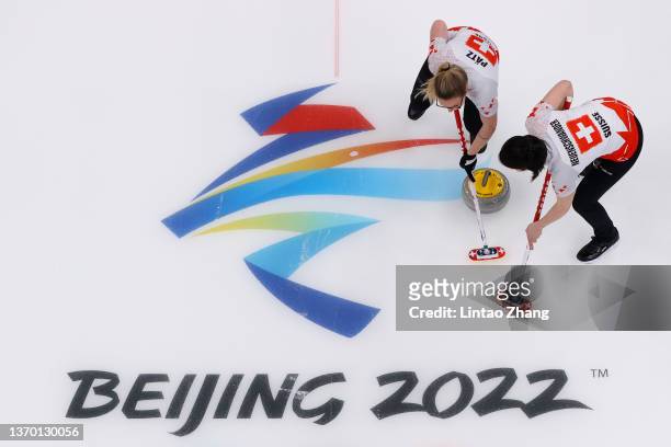 Alina Paetz and Esther Neuenschwander of Team Switzerland compete against Team Denmark during the Women's Round Robin Curling Session on Day 8 of the...