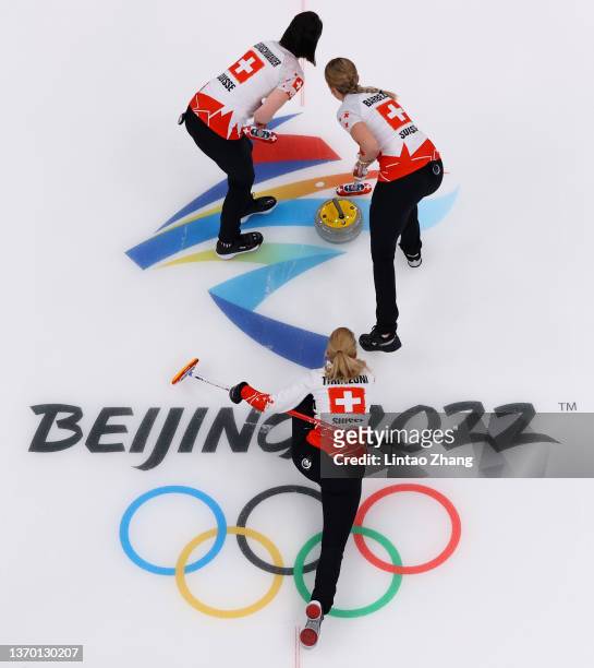 Silvana Tirinzoni, Melanie Barbezat and Esther Neuenschwander of Team Switzerland compete against Team Denmark during the Women's Round Robin Curling...