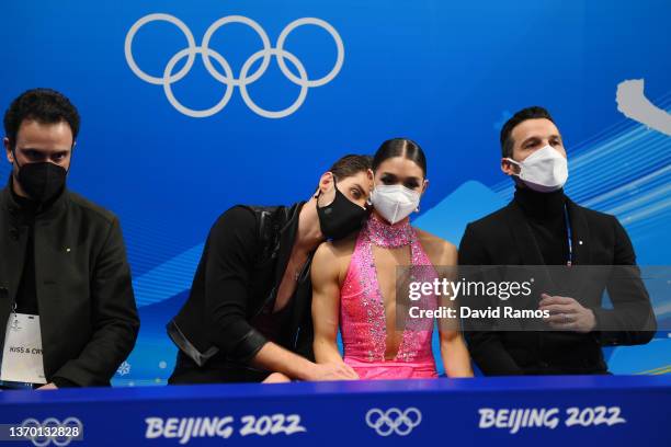 Laurence Fournier Beaudry and Nikolaj Soerensen of Team Canada wait for their score during the Ice Dance Rhythm Dance on day eight of the Beijing...