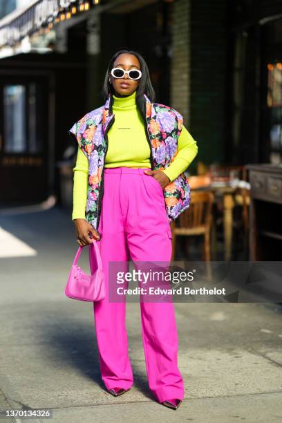 Guest wears white sunglasses, a neon yellow ribbed turtleneck / long sleeves pullover from Calvin Klein Jeans, a black with orange / pink / purple...