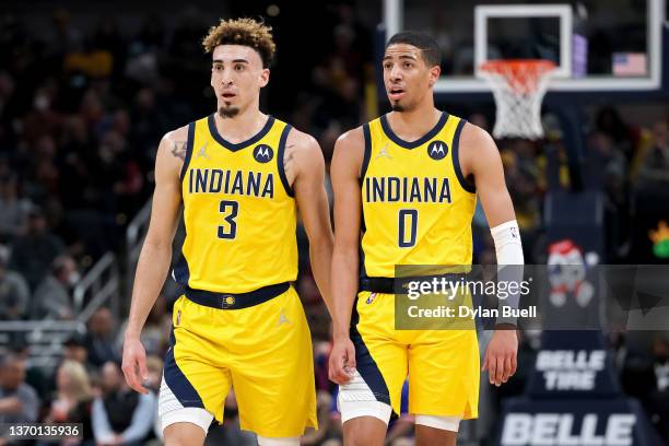 Chris Duarte and Tyrese Haliburton of the Indiana Pacers look on in the first quarter against the Cleveland Cavaliers at Gainbridge Fieldhouse on...