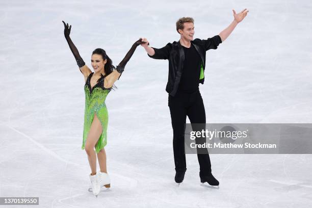 Madison Chock and Evan Bates of Team United States react after skating during the Ice Dance Rhythm Dance on day eight of the Beijing 2022 Winter...