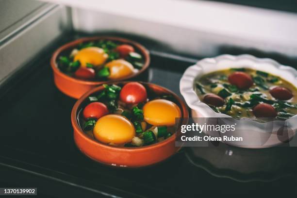 close-up of three bowls with raw ingredients on black tray - microwave dish stock pictures, royalty-free photos & images