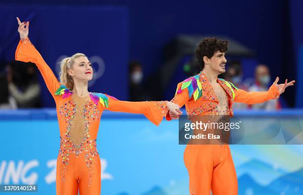 Piper Gilles and Paul Poirier of Team Canada react after skating during the Ice Dance Rhythm Dance on day eight of the Beijing 2022 Winter Olympic...