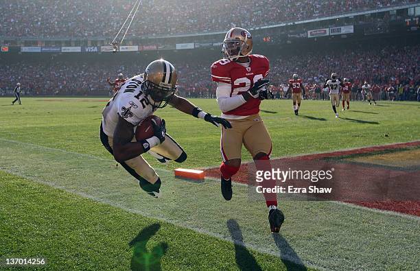 Marques Colston of the New Orleans Saints catches the ball for a touchdown in the second quarter against the San Francisco 49ers in the second...