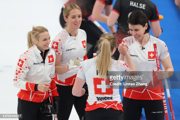 Silvana Tirinzoni, Melanie Barbezat, Alina Paetz and Esther Neuenschwander of Team Switzerland celebrate following victory during the Women's Round...