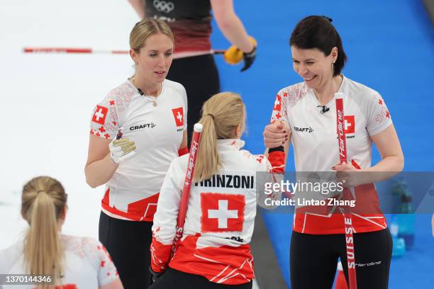 Melanie Barbezat, Alina Paetz and Esther Neuenschwander of Team Switzerland celebrate following victory during the Women's Round Robin Curling...