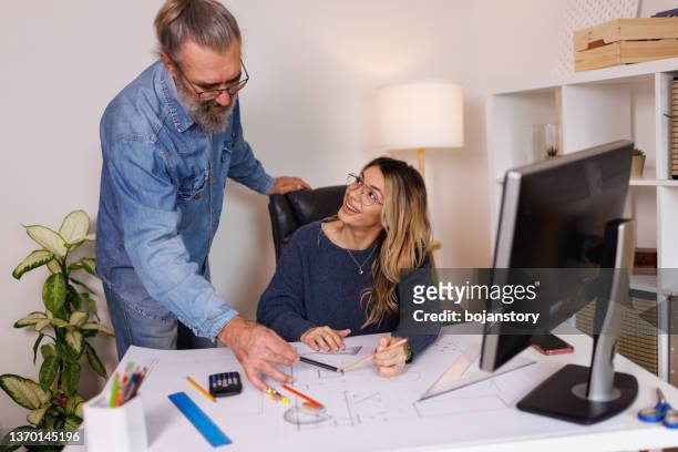 colleagues collaborating on the project - ruler desk stock pictures, royalty-free photos & images