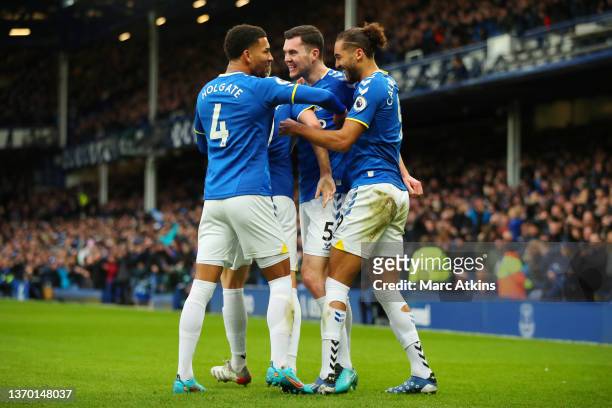 Michael Keane of Everton celebrates with teammates Mason Holgate and Dominic Calvert-Lewin of Everton after scoring their team's second goal during...