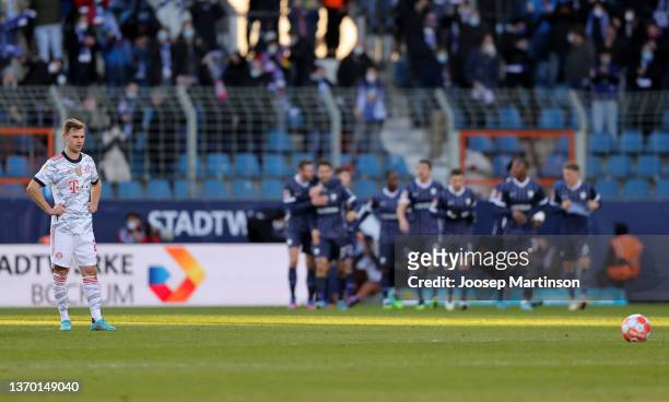 Joshua Kimmich of FC Bayern München reacts while VfL Bochum celebrate a goal during the Bundesliga match between VfL Bochum and FC Bayern München at...