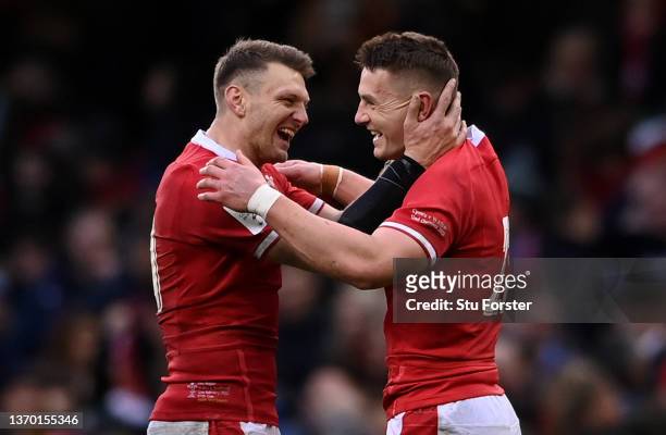 Dan Biggar and Jonathan Davies of Wales celebrate their victory during the Guinness Six Nations match between Wales and Scotland at Principality...