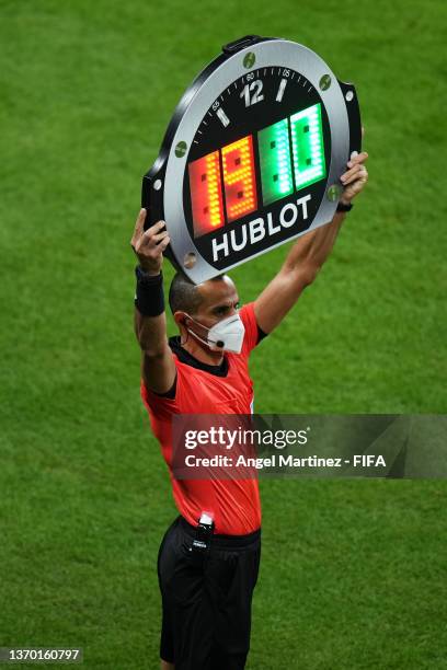 The fourth official Mustapha Ghorbal shows the LED board for a Chelsea substitution during the FIFA Club World Cup UAE 2021 Final match between...