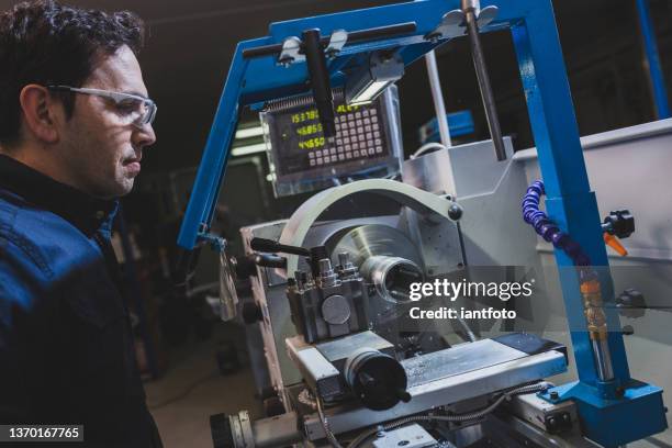 mechanical technician operative of cnc milling cutting machine center at tool workshop. - milling stock pictures, royalty-free photos & images