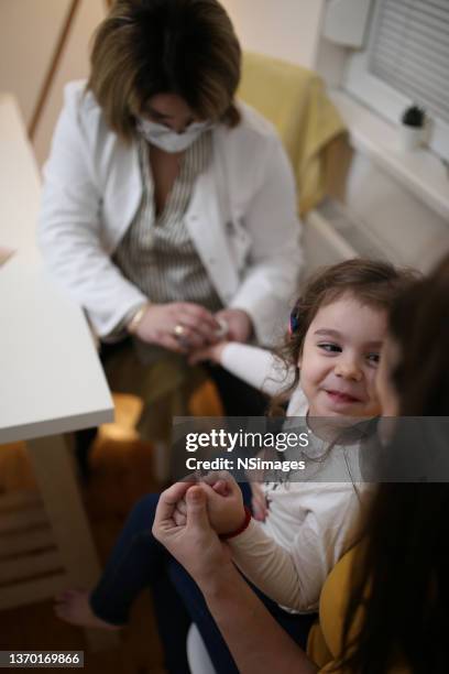 little girl having medical examination by dermatologist stock photo - allergy doctor stockfoto's en -beelden
