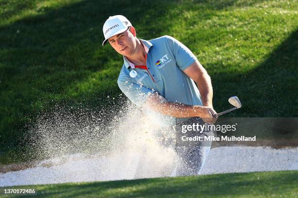 Luke List of the United States hits from the bunker on the 12th hole during the third round of the WM Phoenix Open at TPC Scottsdale on February 12,...