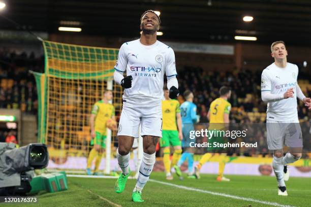 Raheem Sterling of Manchester City celebrates after scoring their team's fourth goal during the Premier League match between Norwich City and...