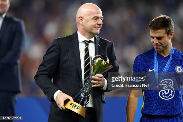 President, Gianni Infantino hands over the FIFA Club World Cup trophy to Cesar Azpilicueta of Chelsea following the FIFA Club World Cup UAE 2021...