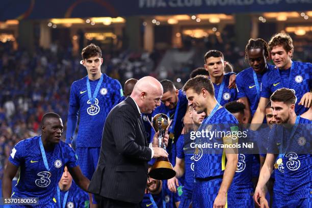 President, Gianni Infantino hands over the FIFA Club World Cup trophy to Cesar Azpilicueta of Chelsea following the FIFA Club World Cup UAE 2021...