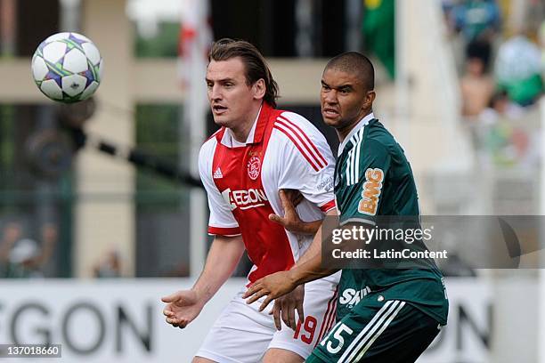 Bulykin from Ajax and Mauricio Ramos from Palmeiras fight for the balla during a match between Palmeiras and Ajax at Pacaembu stadium on January 14,...