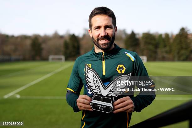 Joao Moutinho of Wolverhampton Wanderers poses with the Wolves Castore January Player of the Month Award at The Sir Jack Hayward Training Ground on...