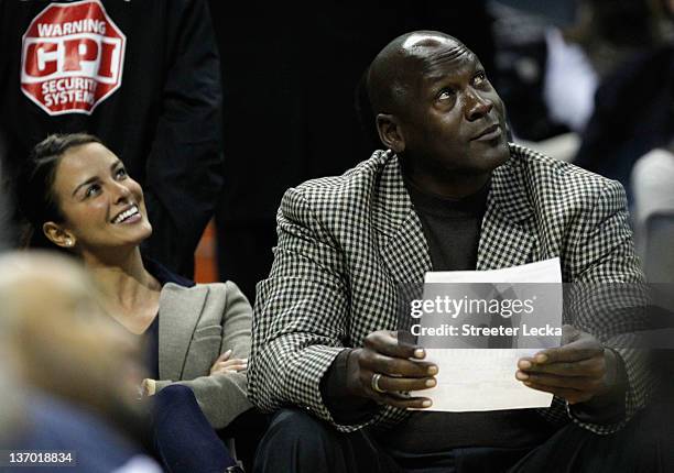 Charlotte Bobcats owner, Michael Jordan sits beside fiance, Yvette Prieto during the Golden State Warriors versus Charlotte Bobcats game at Time...