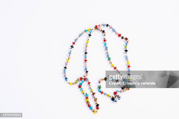 colorful necklace trinket on white background - bauble white background foto e immagini stock