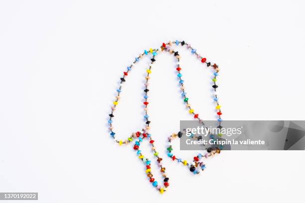 colorful necklace trinket on white background - bead necklace stock pictures, royalty-free photos & images