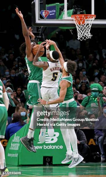 February 11: Denver Nuggets forward Will Barton loses control of the ball under pressure from Boston Celtics center Robert Williams III and Boston...
