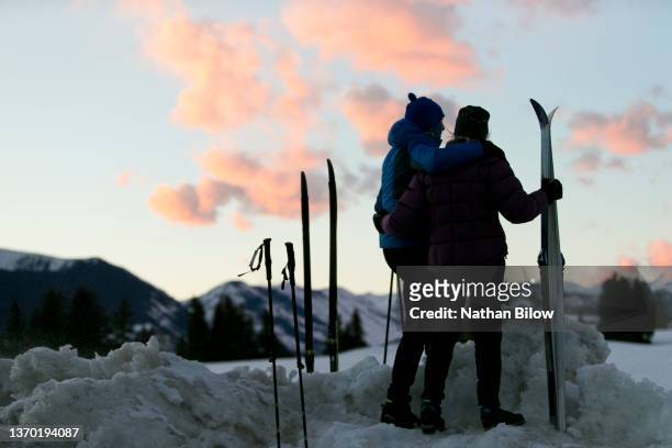 outdoor winter sports with seniors - skier silhouette stock pictures, royalty-free photos & images