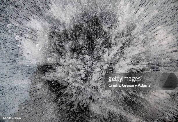 bubbles in ice in the winter - water black and white stock pictures, royalty-free photos & images