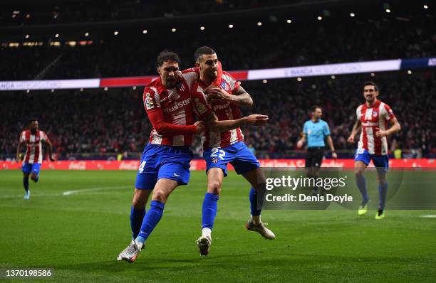 Mario Hermoso of Atletico de Madrid celebrates with Sime Vrsaljko of Atletico de Madrid after scoring their team's fourth goal during the LaLiga...