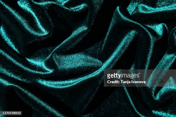 texture of velour fabric is emerald green. - emerald green stock pictures, royalty-free photos & images