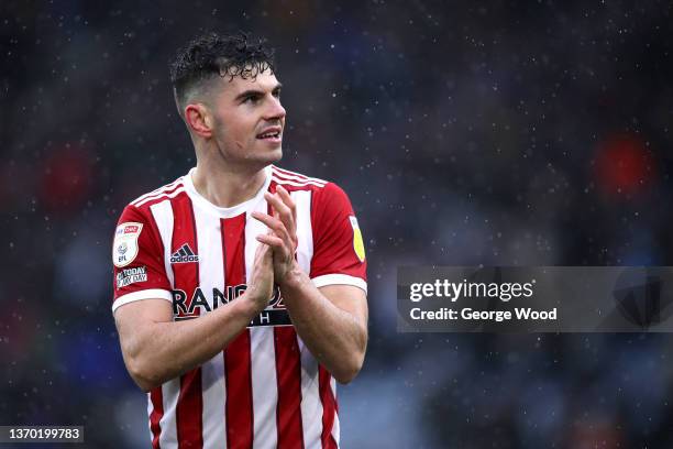 John Egan of Sheffield United applauds the fans following the Sky Bet Championship match between Huddersfield Town and Sheffield United at Kirklees...