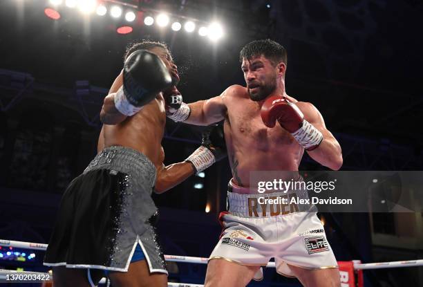 John Ryder punches Daniel Jacobs during the super-middleweight fight between Daniel Jacobs and John Ryder at Alexandra Palace on February 12, 2022 in...