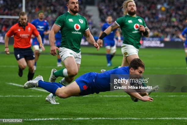 Antoine Dupont of France dives over to score the first try of the match during the Six Nations match between France and Ireland at Stade de France on...